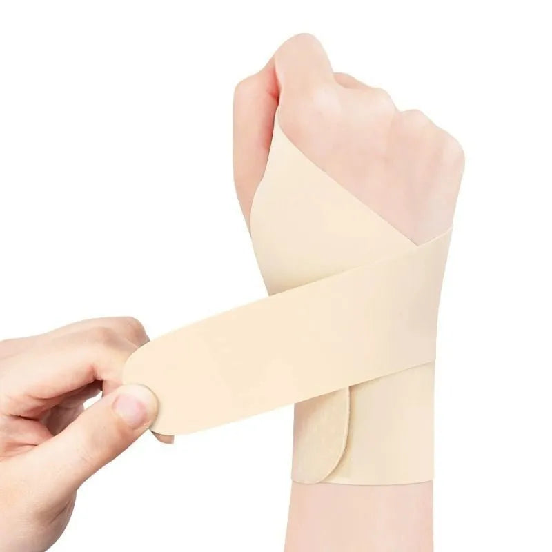 A pair of adjustable athletic wristguards in black, shown on a wrist.