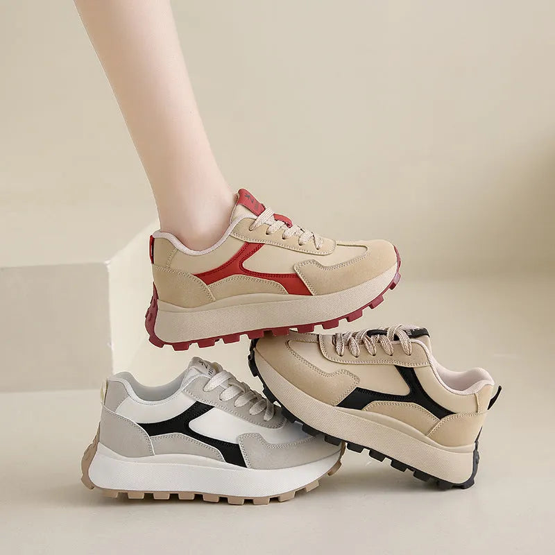 Women's solid colour platform sports running shoes with mesh upper and rubber sole in three colour options.