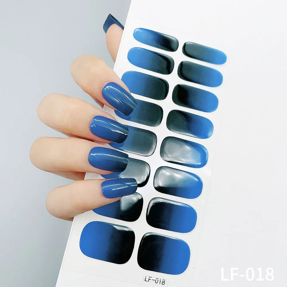 Full coverage nail art stickers sheet with 16 designs including cross, rose, tulip, and cartoon patterns.
