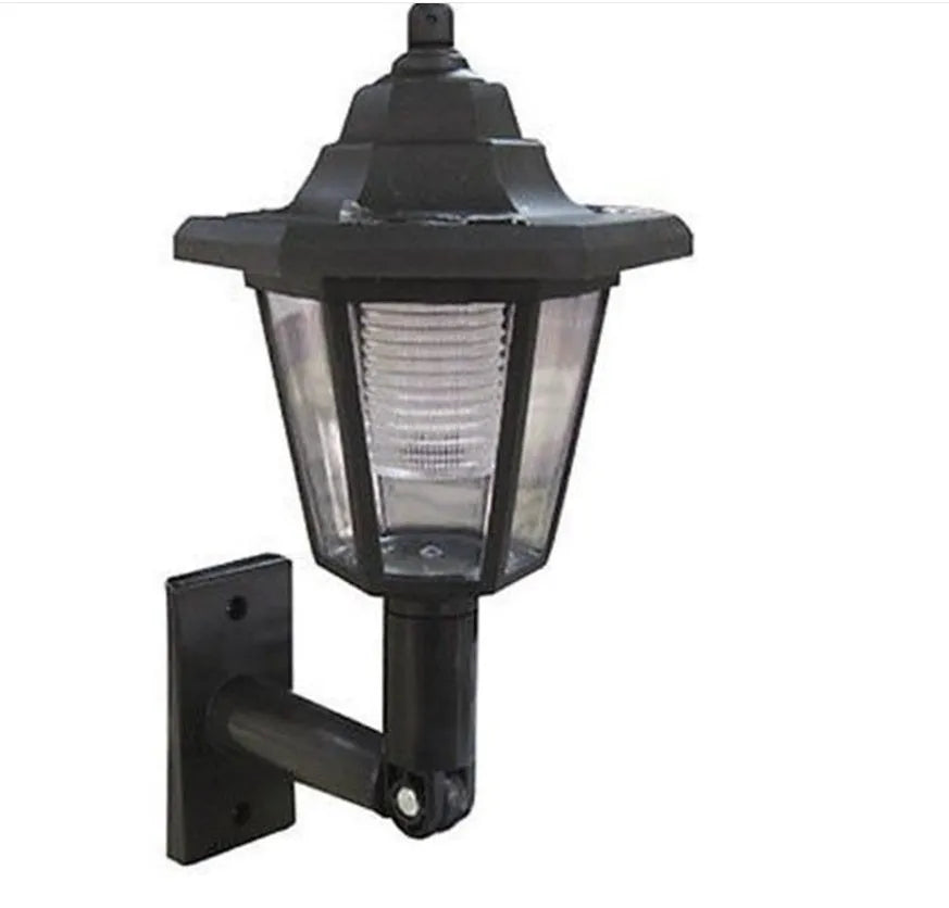 Black hexagonal solar-powered LED wall light with light sensor for outdoor garden use