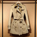 Women's khaki polyester trench coat with double-breasted front and flight sleeves
