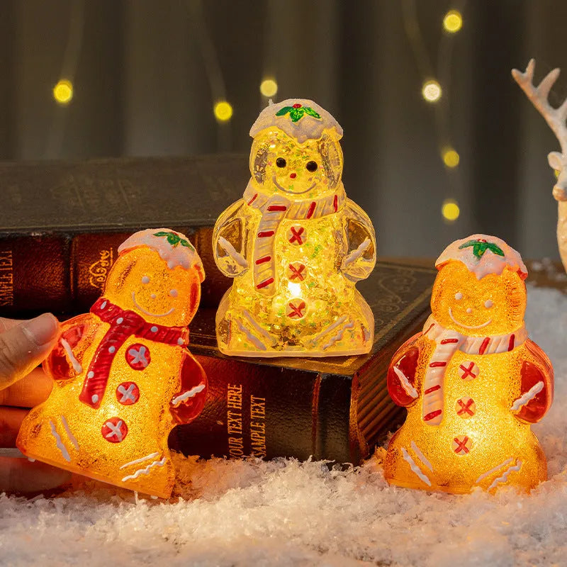 Glowing gingerbread man Christmas ornament with LED light and red scarf, measuring 6.5cm wide by 10.5cm tall