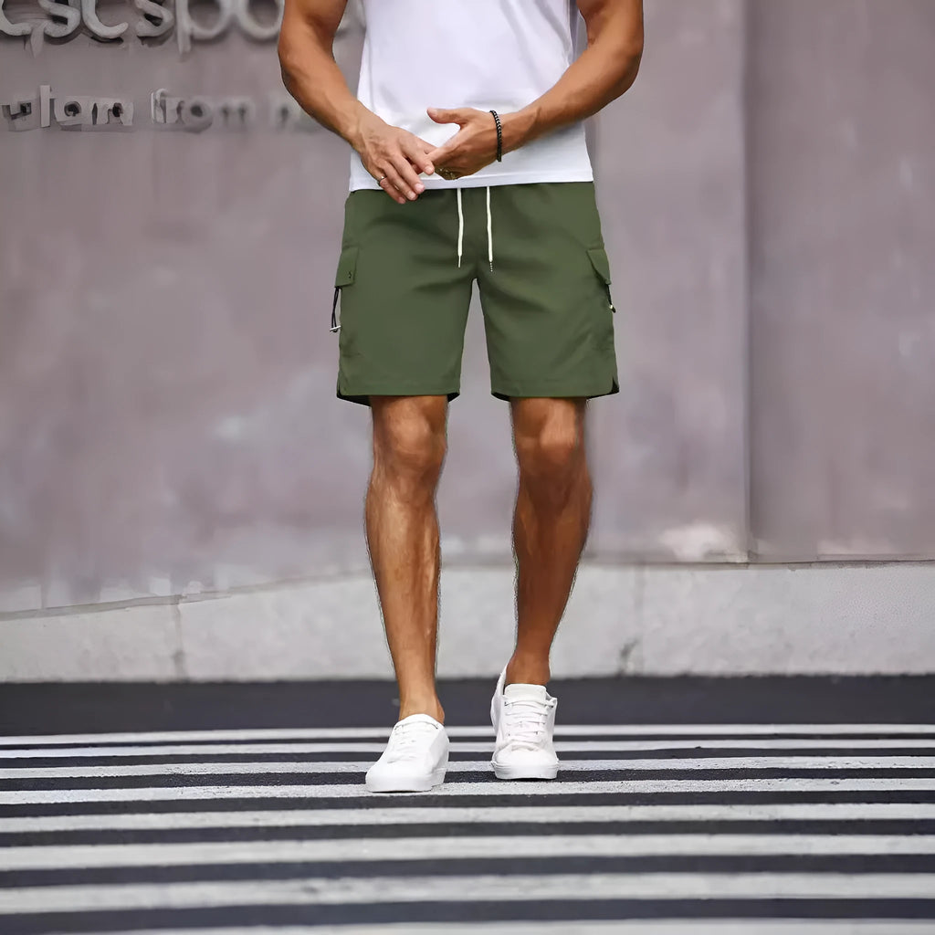 Men's loose-fitting workwear shorts in army green colour with a straight leg and elasticated waistband