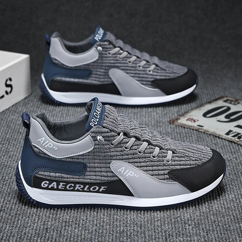 Men's grey and green mesh running shoes with lace-up front and low-top design