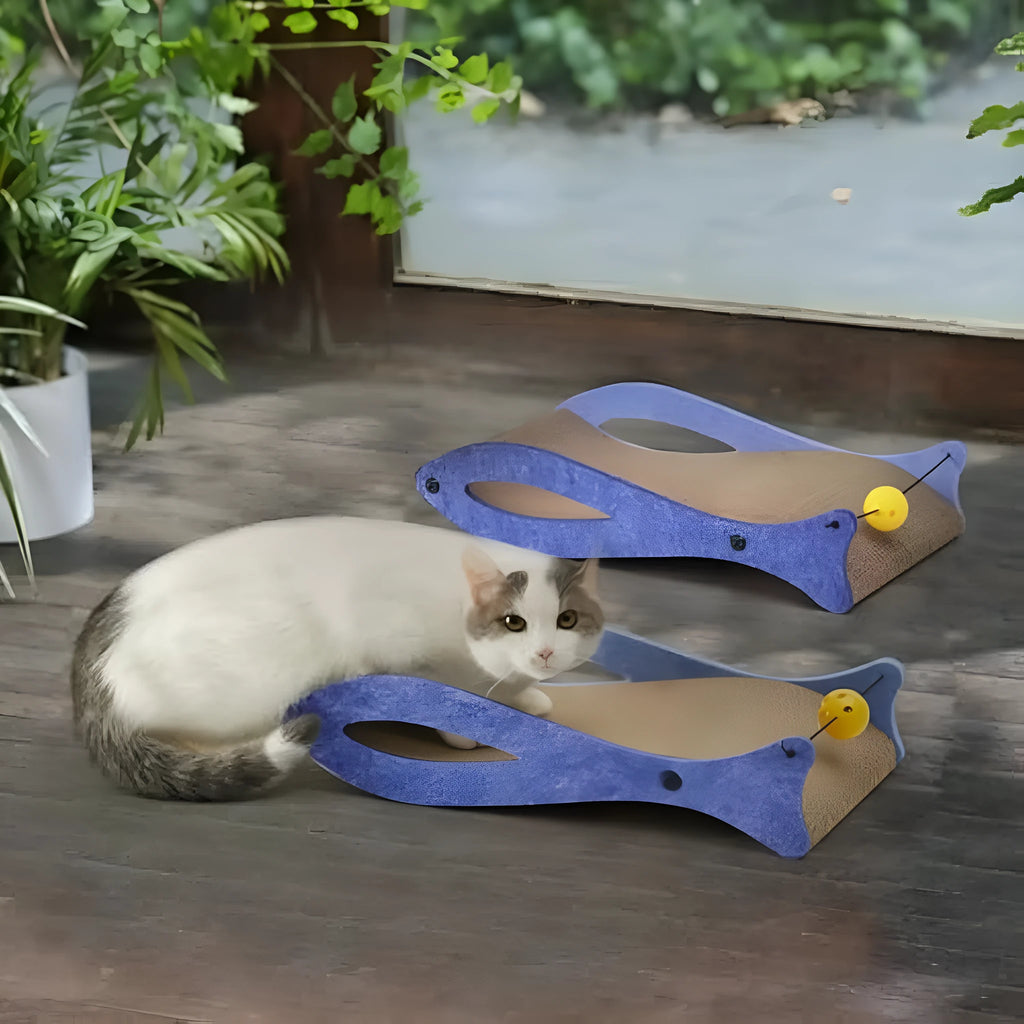 Blue fish-shaped cardboard cat scratcher lounge with bell ball toys on an elastic cord.