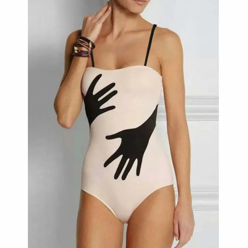 Women's patterned bikini swimsuit with a flowing white tulle skirt attached.