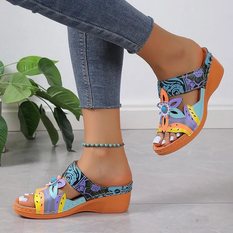 Women's ethnic design slipper sandals with coloured slope and totem pattern on a cowhide upper.