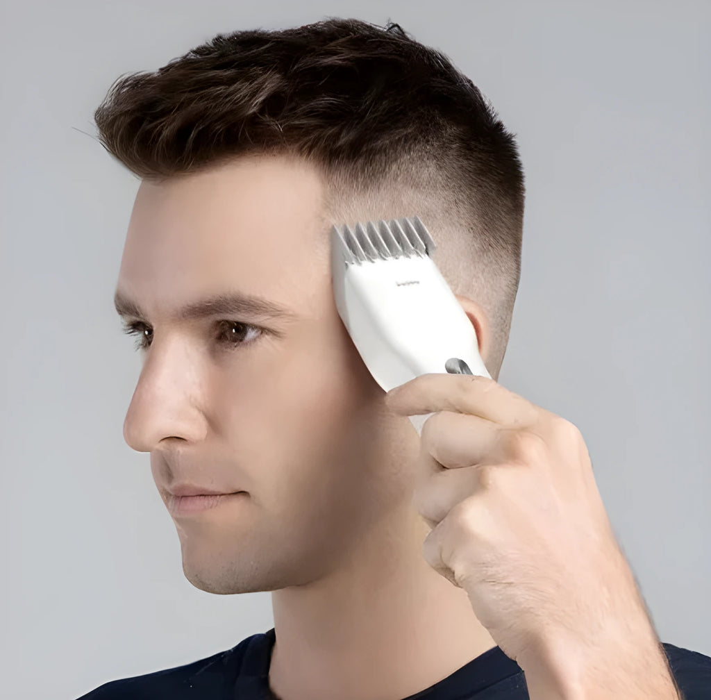 Black cordless men's electric hair clipper with adjustable slider comb and ceramic cutter head.
