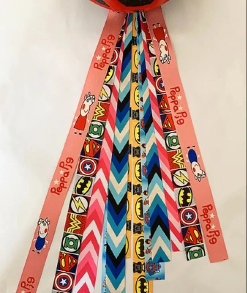 Decorative ribbon streamer for a child's ski or skating helmet in various colour options.