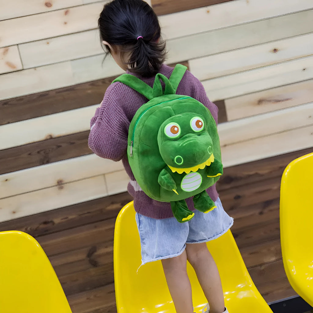 Dinosaur plush backpack with soft handle and embroidery details in children's backpack style