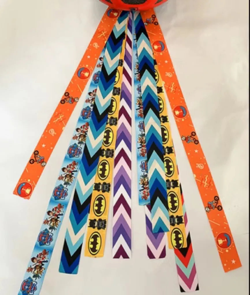 Decorative ribbon streamer for a child's ski or skating helmet in various colour options.