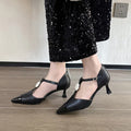 Women's black stiletto heel pointed toe shoes with floral decoration and buckle details