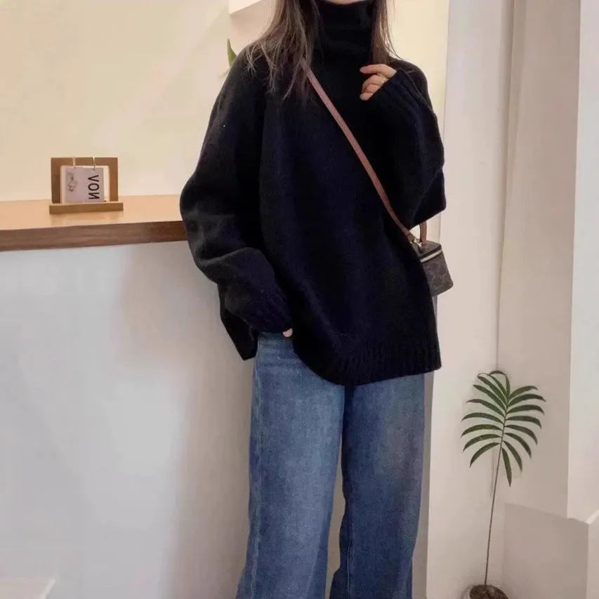 Red women's loose turtleneck sweater with a textured curling pile collar, shown in a casual setting.