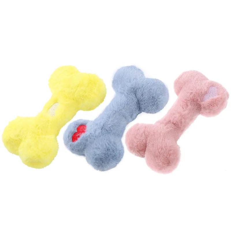 Blue plush bone-shaped dog toy with a squeaker, labelled Grinding Teeth, on a plain background