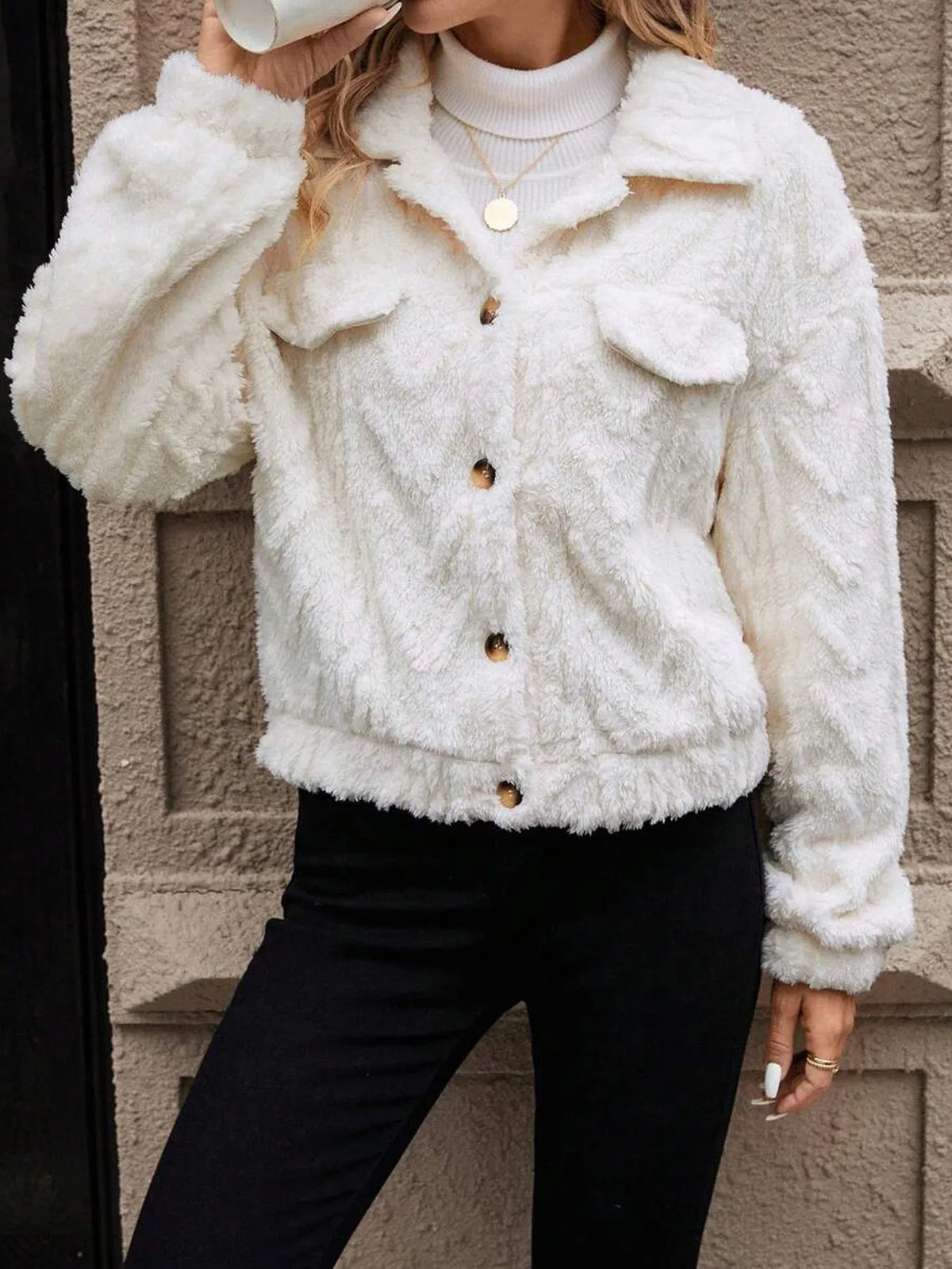 Ivory white women's plush cardigan coat with button front closure.