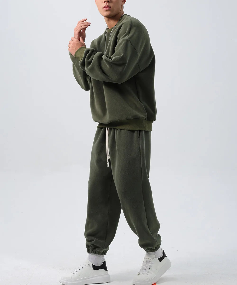 Men's black polar fleece sports suit with padded crew-neck coat and matching trousers