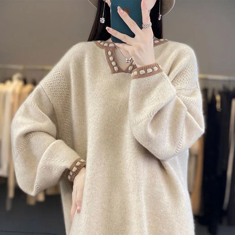 Women's camel coloured V-neck long sleeve viscose pullover sweater laid flat.