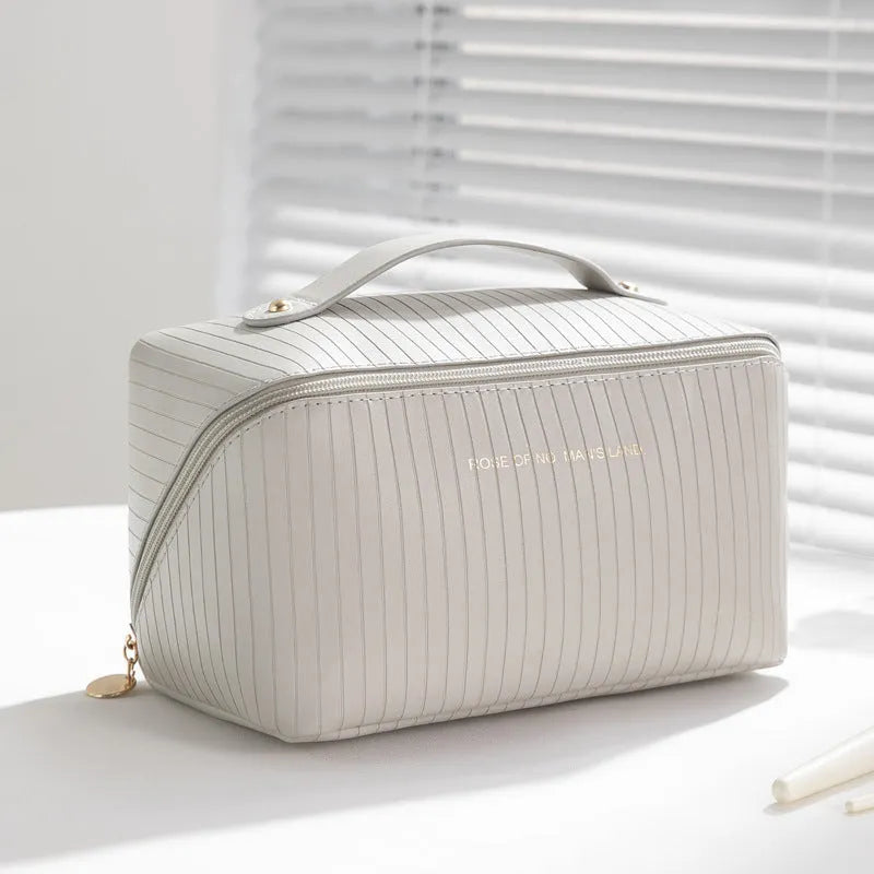Vertical cubic pillow makeup bag in PU material with 22.5 cm height for travel storage