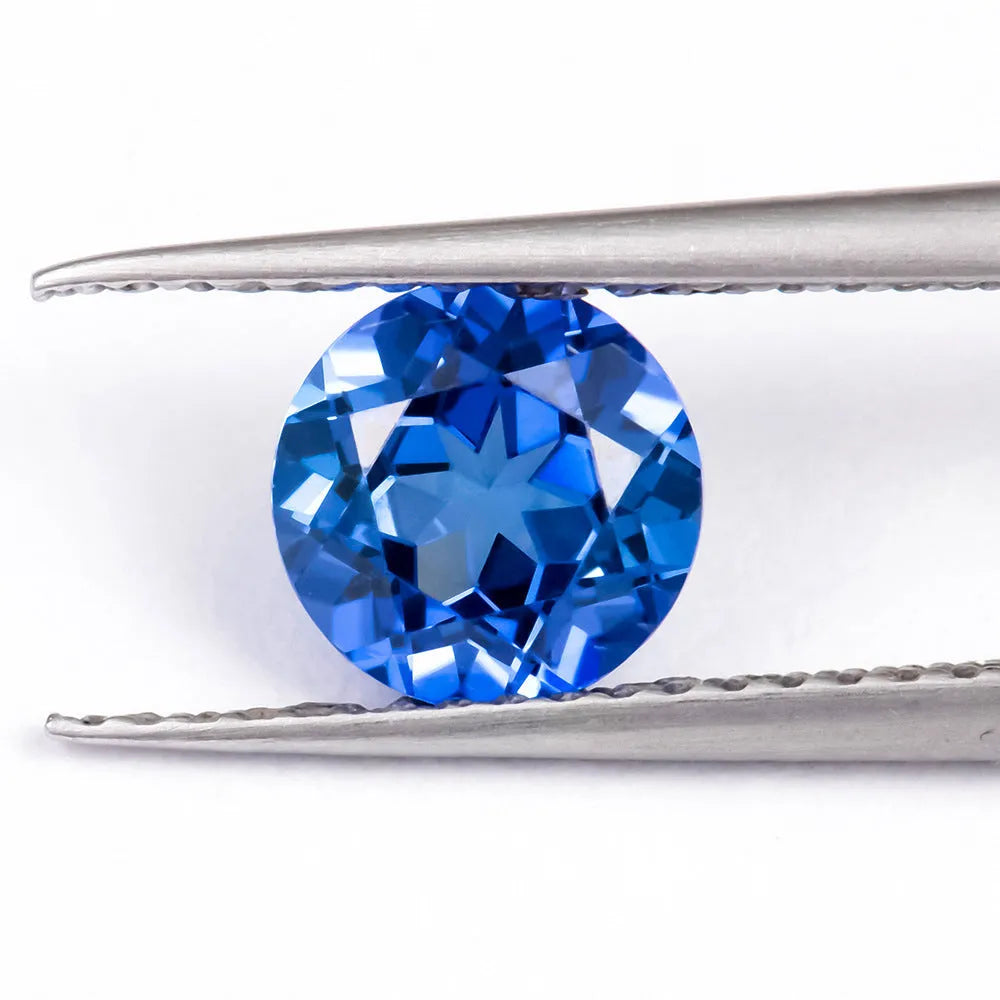 Royal blue love-shaped tiara cut gemstone for jewellery making on a white background.