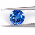 Royal blue love-shaped tiara cut gemstone for jewellery making on a white background.