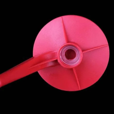 Red plastic Magic Tap soda dispenser for 2-litre bottles.