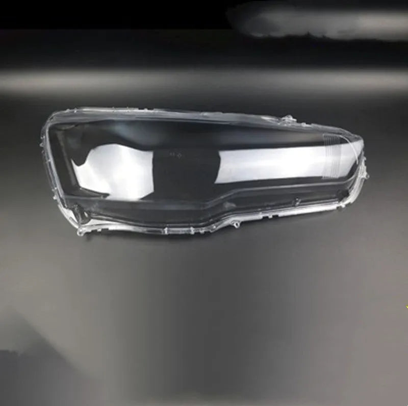 Transparent plastic headlight housing cover measuring 50x30x20mm for vehicle lampshade protection