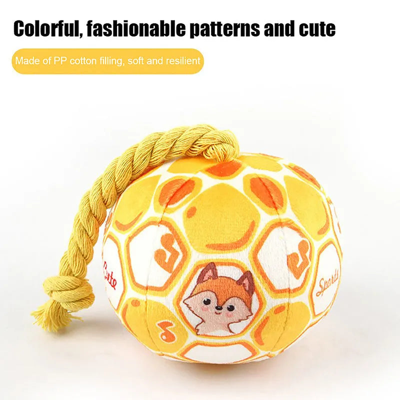 Elastic football design dog toy with cotton rope exterior and squeaker ball