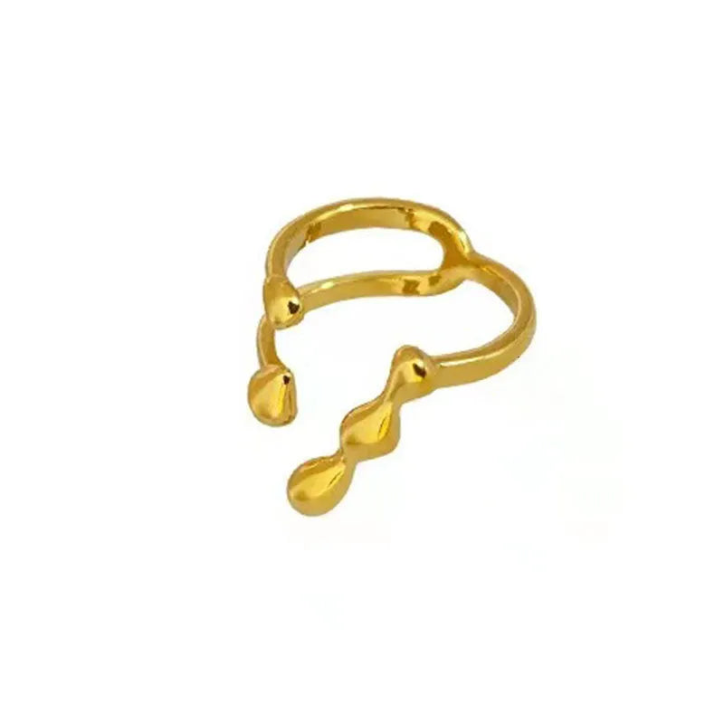 Brass adjustable fashion ring with spherical detail in gold or silver finish.