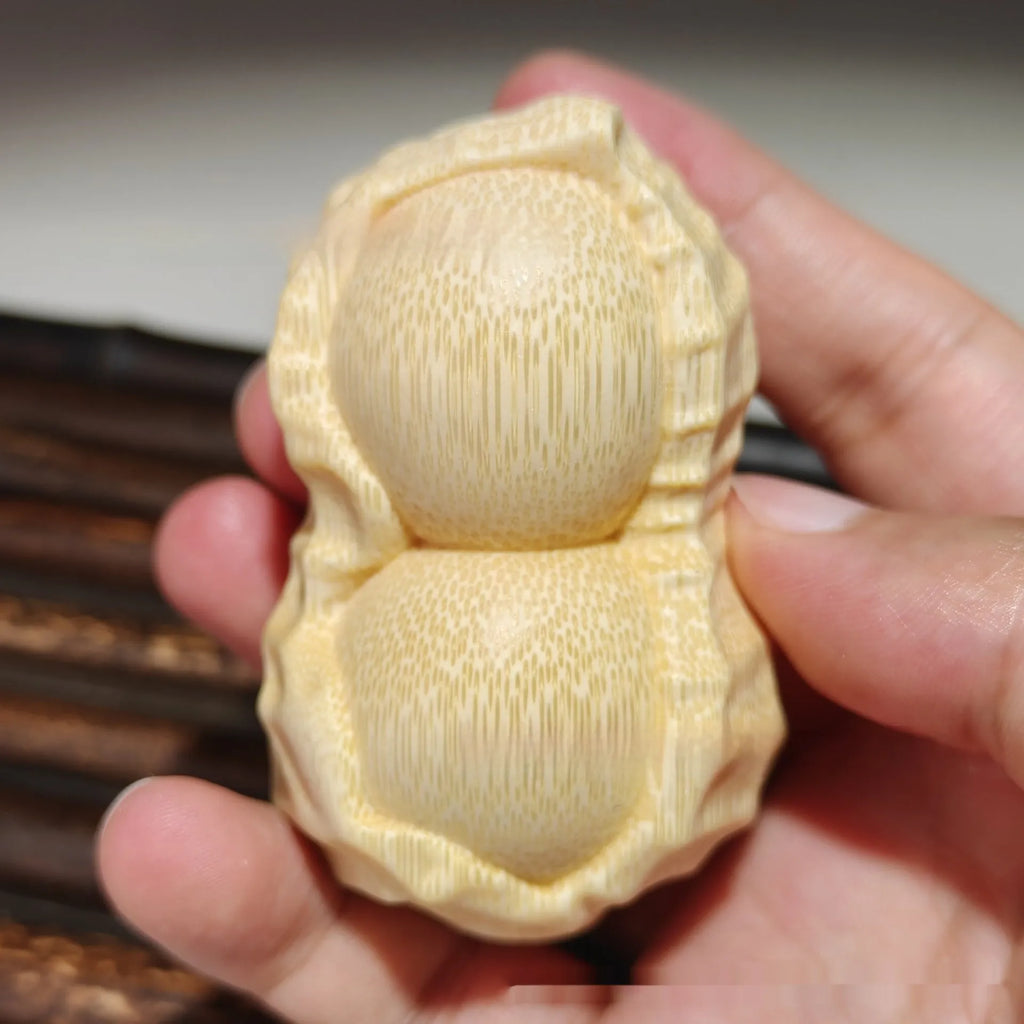 Solid bamboo carving peanut ornament with modern simplicity style and 'May Good Things Happen' message