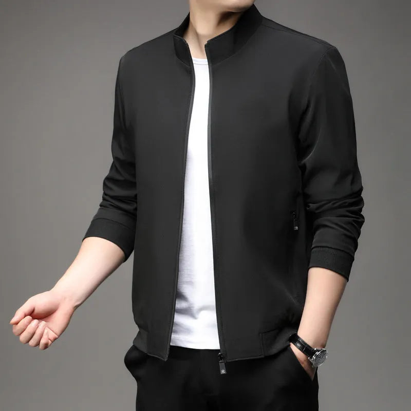 Man wearing a black Korean-style loose lapel casual jacket with zipper pockets