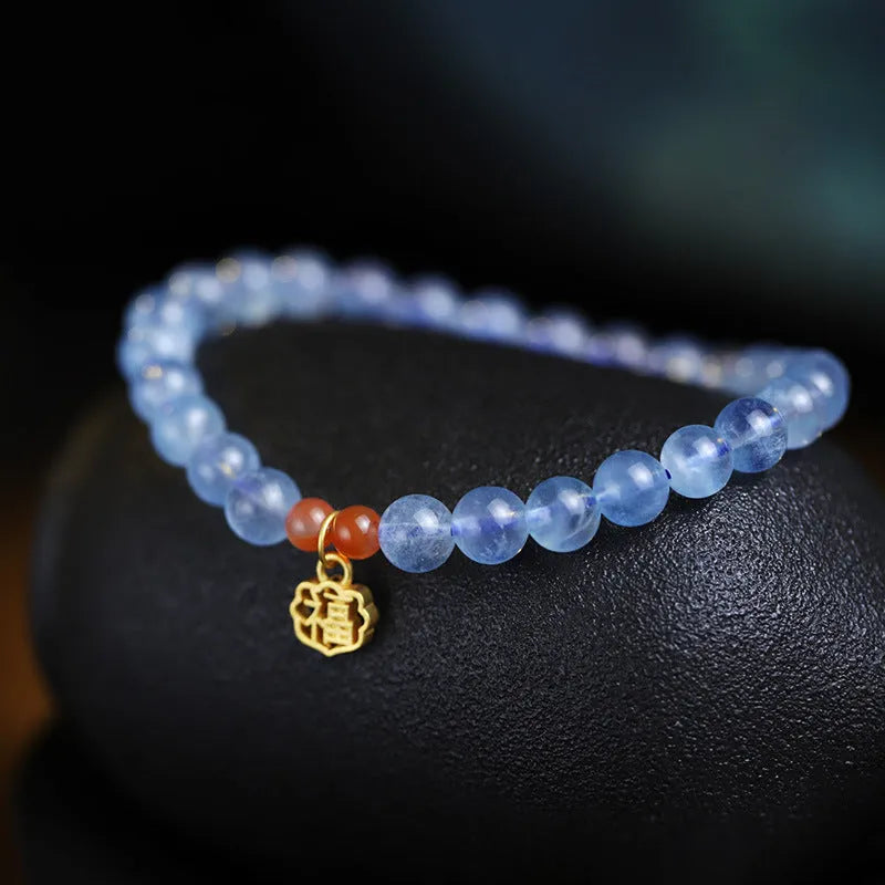 Natural aquamarine crystal blessing card bracelet with icy translucent 8mm round beads and sequin accents.