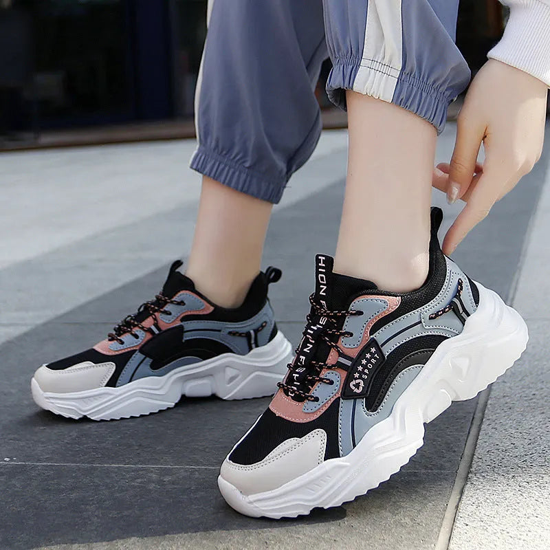 Women's white casual sports shoes with thick sole, mesh upper, buckle detail and round toe