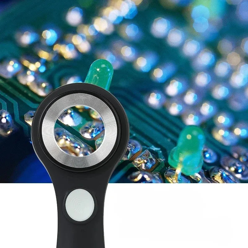 Black handheld magnifying glass with USB-C cable for charging its built-in inspection light.