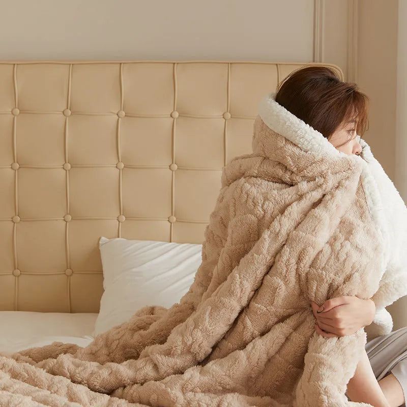 Polyester thermal flannel blanket in beige colour showing modern simple style on a bed.