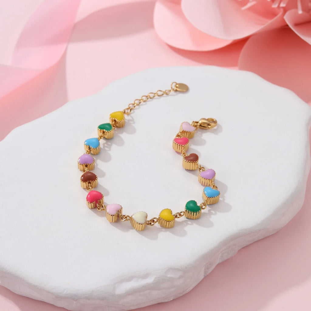 Women's titanium steel bracelet with love heart pendant in gold or steel electroplated finish
