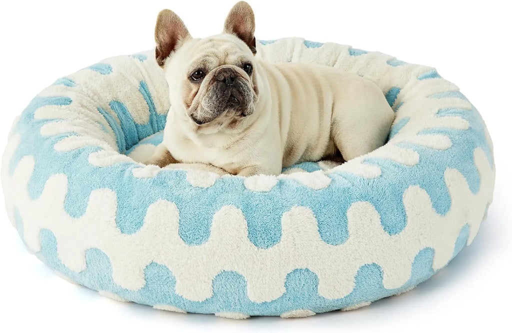 Round plaid dog bed on a plastic base, shown in sea blue and white check pattern.