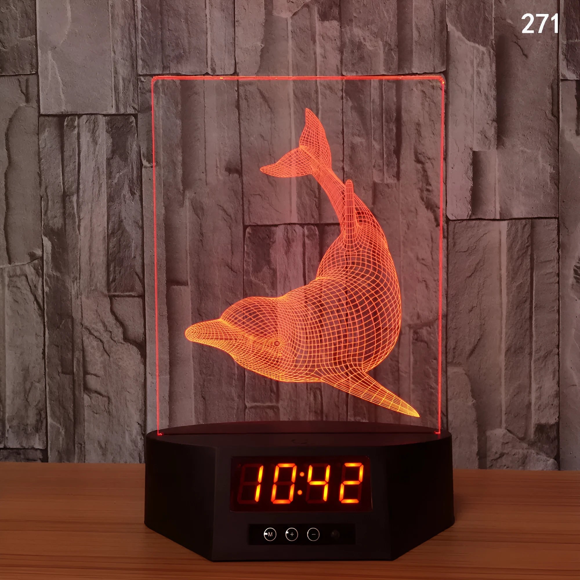 3D blue dolphin LED table night light with remote control on wooden surface