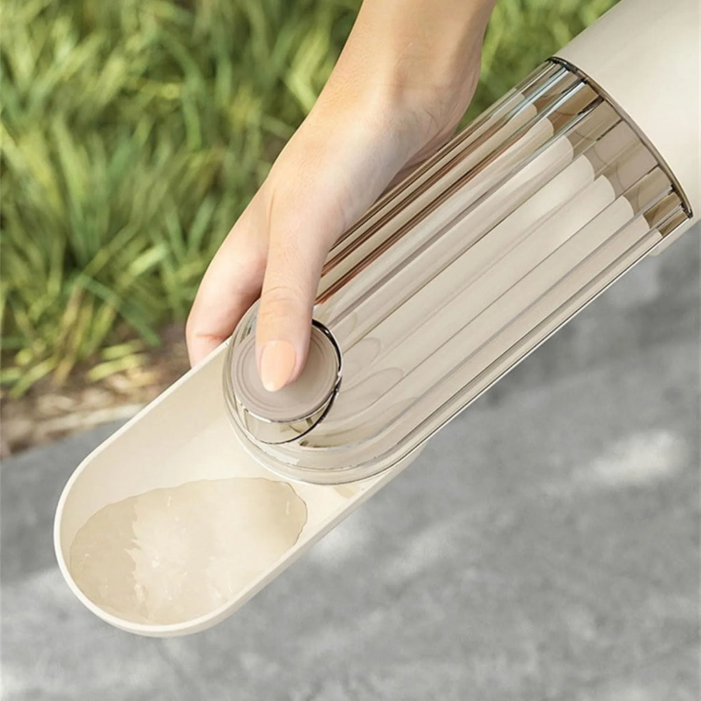 Beige foldable dog water bottle with drinking tray and base food container, shown open and closed