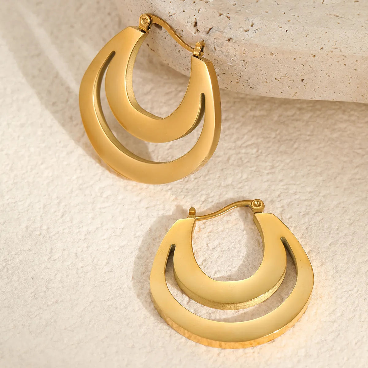 Geometric French earrings with stainless steel construction and 18K gold plating in minimalist design
