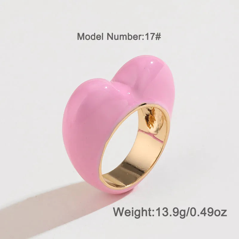Three-dimensional heart-shaped enamel ring in a choice of colours on a zinc alloy band.