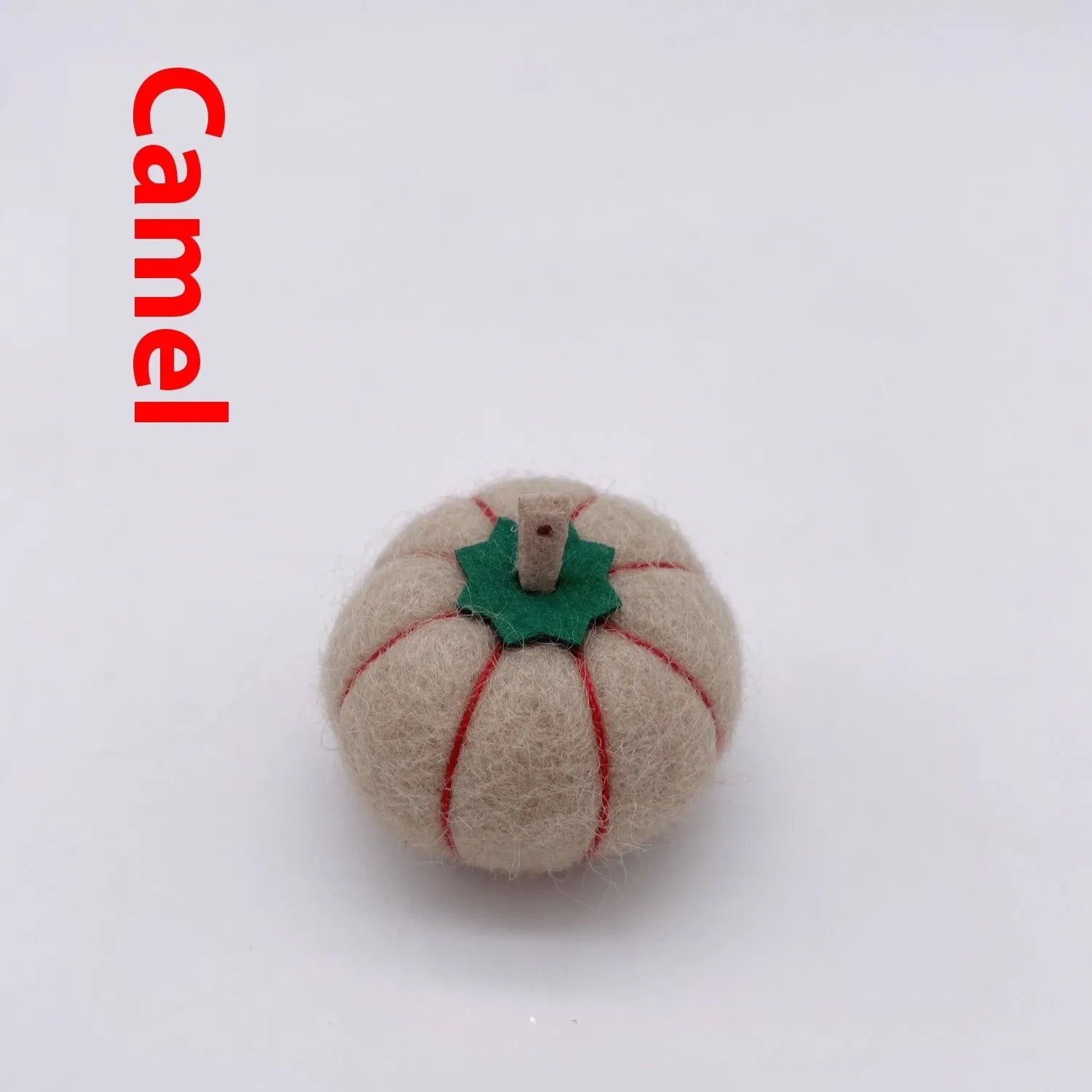 Wool felt pumpkin ornament measuring 5cm diameter in autumn colours for miniature displays