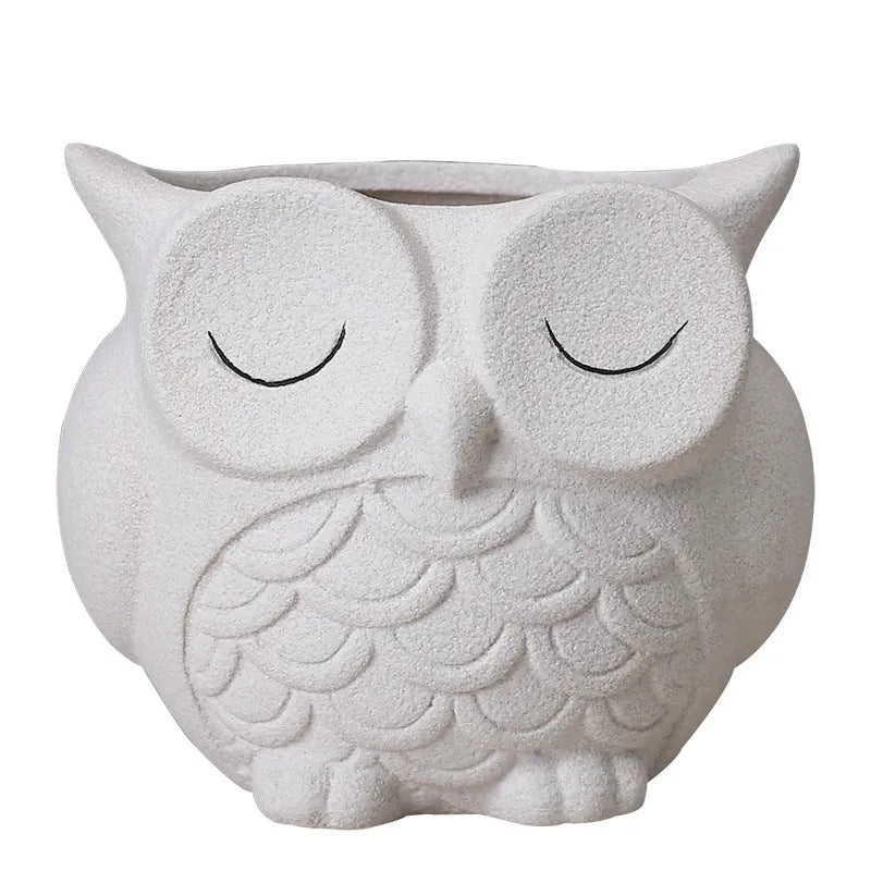 Handmade ceramic owl-design succulent pot in frosted light pink, white, green, or blue, measuring 11cm by 9cm.