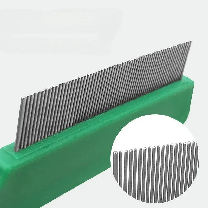 Green plastic-handled pet comb with stainless steel pins for flea and hair removal.