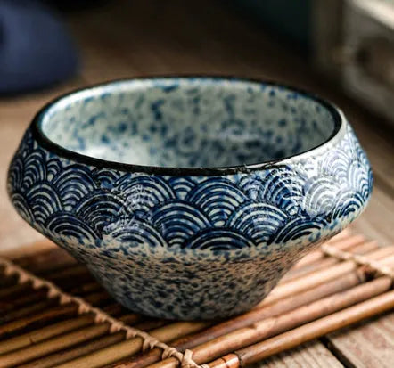 Tall porcelain Japanese soup bowl with stone conch shape and underglaze retro pattern.