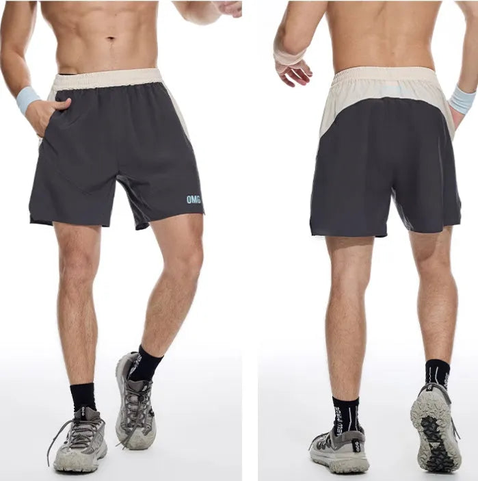 Men's loose dark grey workout shorts with a white lace-up fly front on a neutral background.