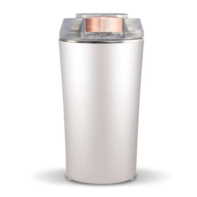 Blue compact electric mini flour mill and spice grinder on a kitchen countertop