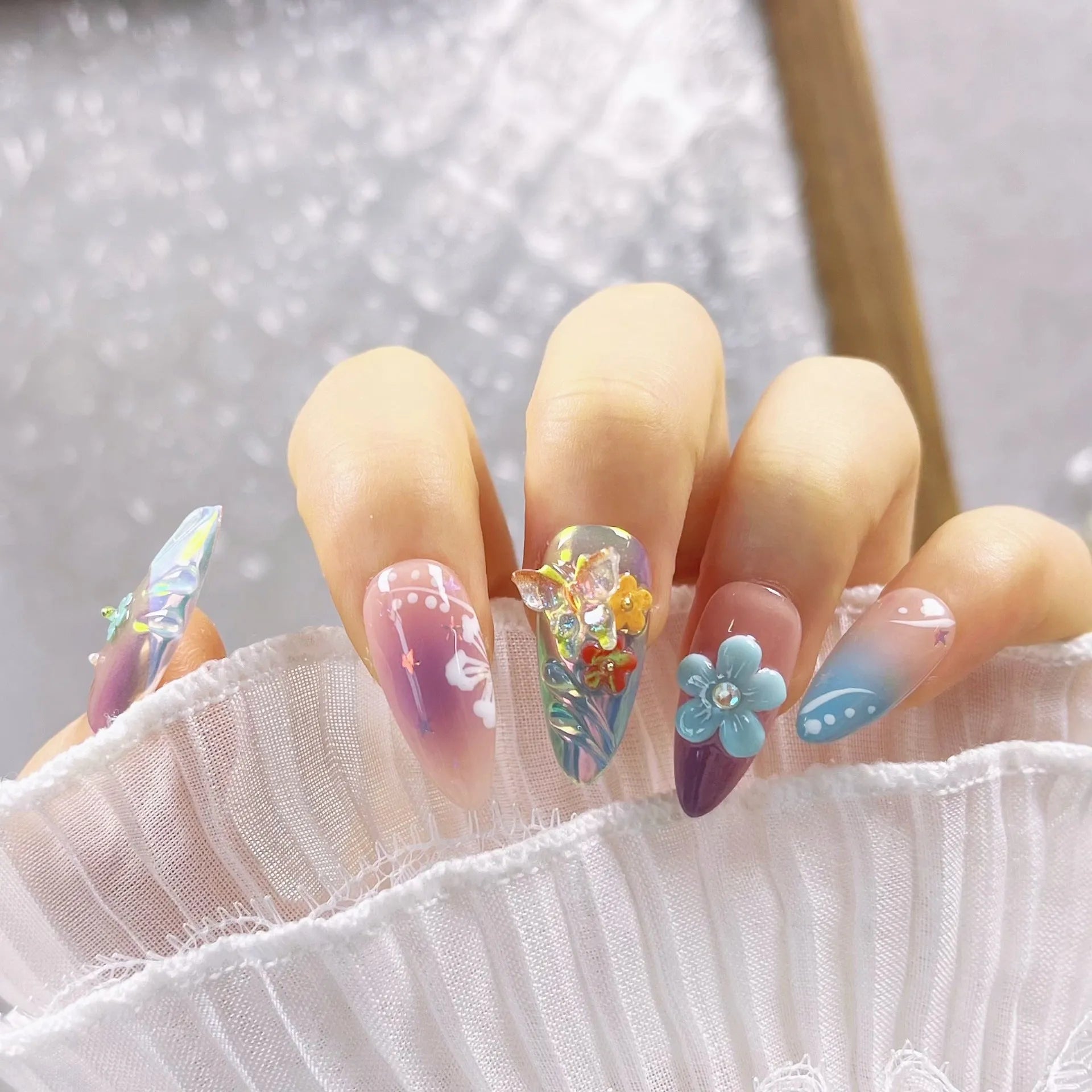 Handmade colourful small flower and butterfly nail art sculptures for gel manicure decoration