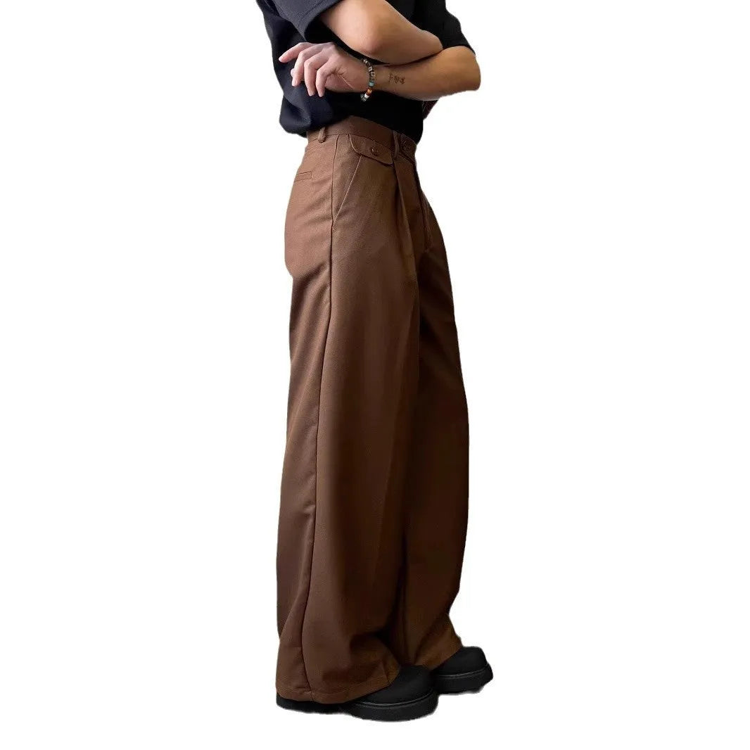 Brown men's straight-leg loose-fit suit trousers laid flat, showing wide-leg drape style.
