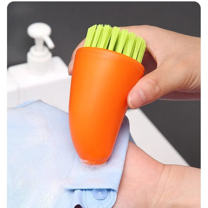 Carrot-shaped orange and white kitchen cleaning brush with nylon bristles