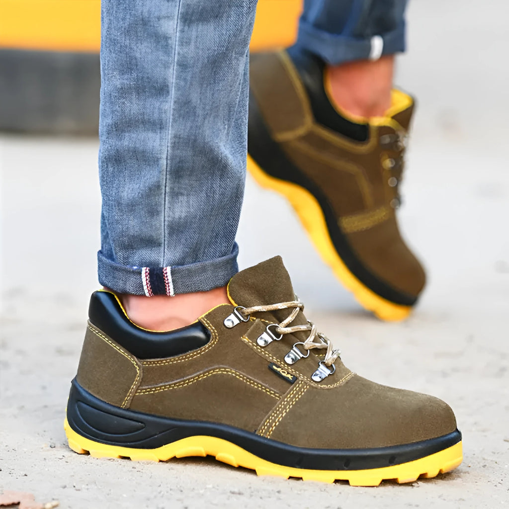 Bronze coloured low-cut cow suede safety work boots with a steel toe cap on a grey background